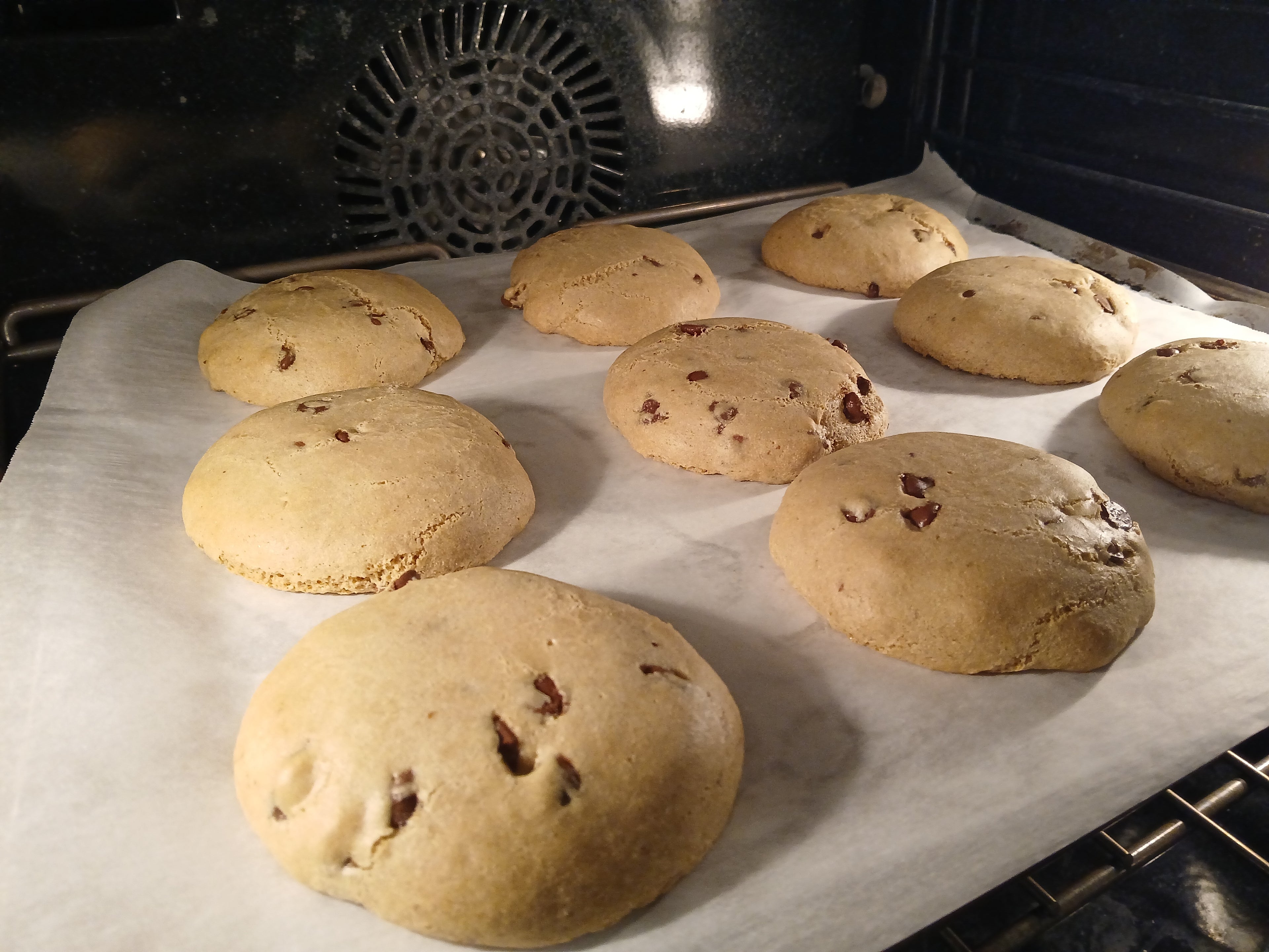 Baked cookies on a baking sheet inside an oven