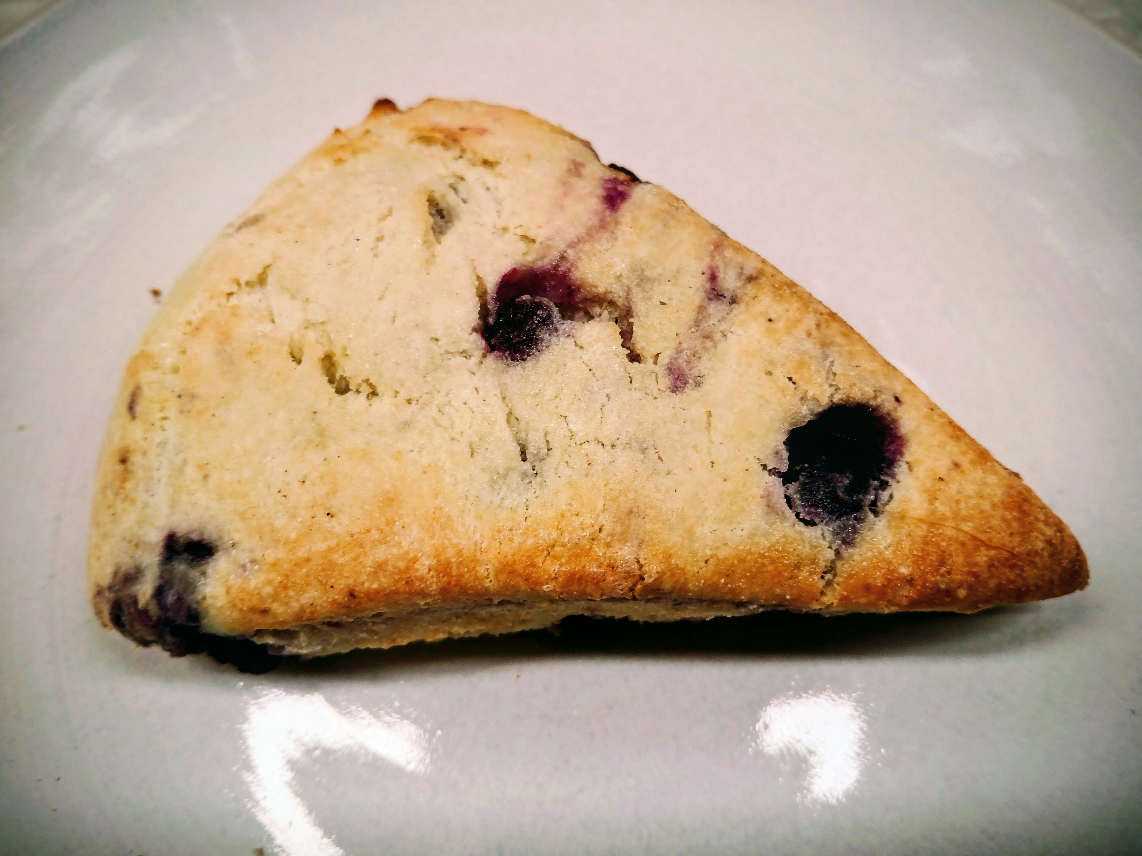 GF Blueberry scone on a white plate