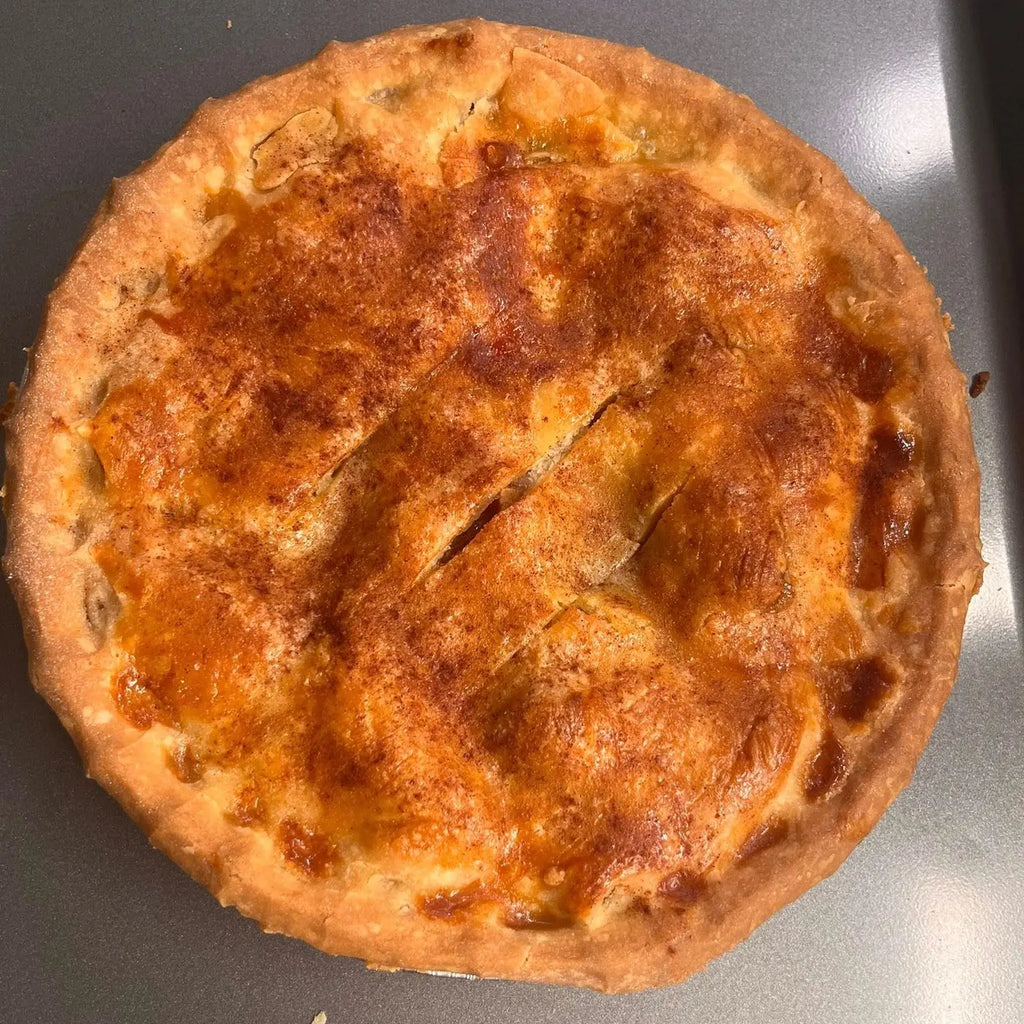 Baked gluten free apple pie on a gray surface