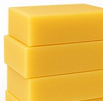 Stack of yellow soap bars on a white background